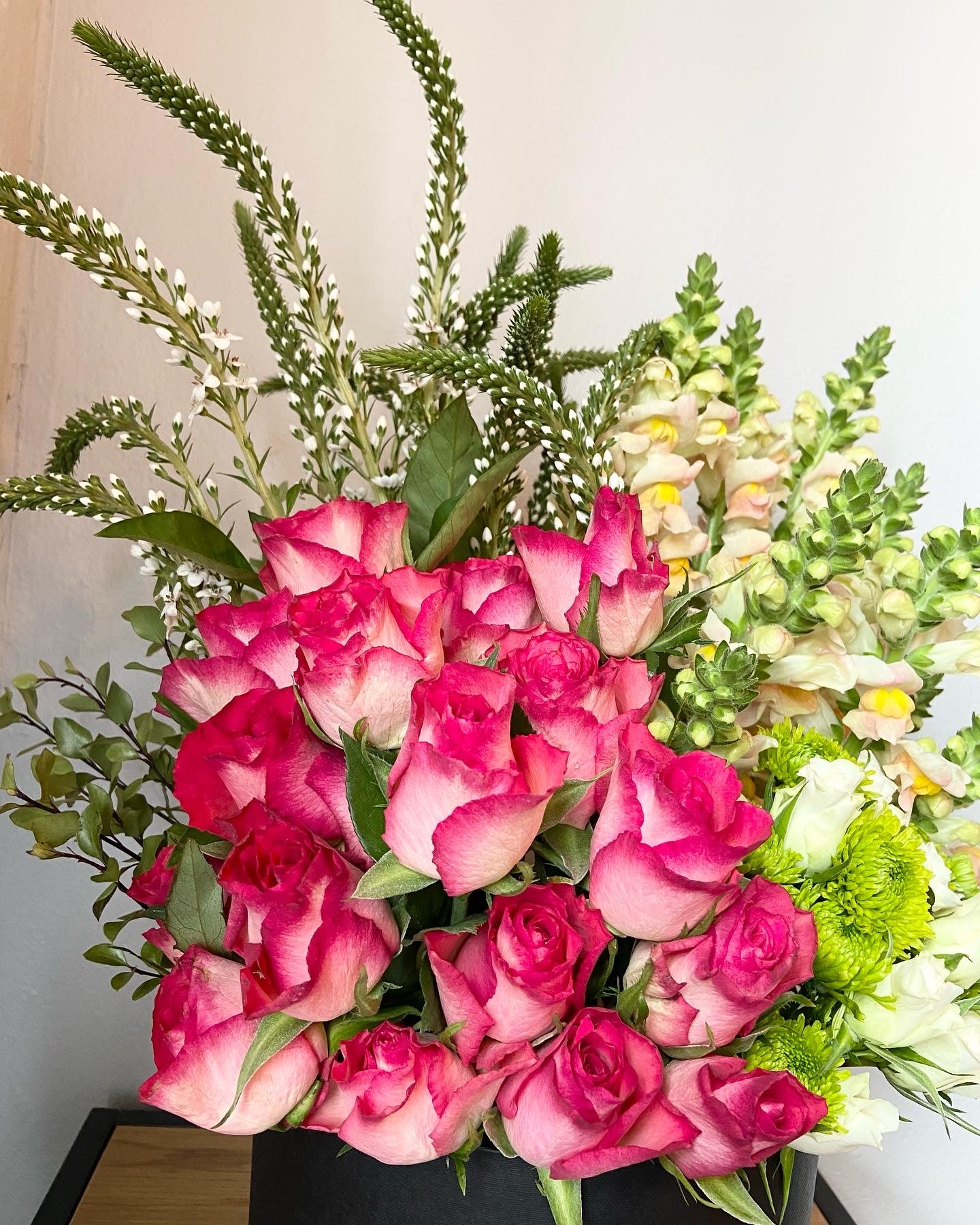 Pink cascade floral arrangement in large hatbox